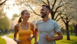 © miss irine - Happy couple run together in park. Smiling man and woman jog in green spring sunny weather. They enjoy sport activity outdoors. Active lifestyle concept.