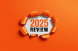 © FATNA - 2025 review concept torn paper effect with bright orange background business and financial year assessment