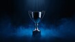 © Den Boro Day - Gleaming Trophy, Illuminated by Azure Light, Against a Misty Backdrop.