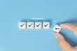 © Achmad Khoeron - Checklist and task progress tracking concept. A hand placing the final checkmark on dice in a progress bar, task completion, productivity, goal setting, and efficient project management