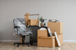 © Pixel-Shot - Wrapped furniture with stretch film and moving boxes in office