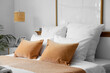 © Pixel-Shot - Cozy bed with soft pillows in stylish hotel room, closeup