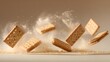 © Jojo* - Multiple rectangular cream-filled biscuits explode midair showering fine crumbs