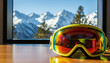 © Alex - Ski goggles on table by window symbolizing anticipation of winter sport