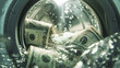 © Agus Sriyanto - Stack of US dollar bills spinning inside a washing machine with bright light