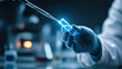 © Darya - Scientist holding a pipette and a test tube with a glowing blue liquid, modern laboratory research and biotechnology experiment
