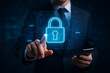 © Roy64 - Cybersecurity data protection concept with businessman pressing digital lock icon for secure network and information safety
