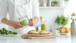 © acnaleksy - man preparing a nutritious breakfast of avocado toast, eggs, and a green smoothie in a bright modern kitchen
