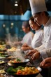 © Iryna - Asian chefs cooking gourmet dishes in professional kitchen setting