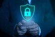 © bigjom - Phone data security protect from scam and mobile crime. Concept of digital security, internet protection and cyber crime. Businessman holding smartphone with a blue shield on it.