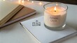 © Adawize - Relaxing Evening Scene with Candle and Notebooks for Calm Atmosphere