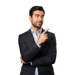 © 3D render png - Professional man in dark suit and light blue shirt pointing to the right side with a confident expression isolated on transparent background