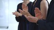 © rogerphoto - Business professionals and colleagues clapping hands, expressing gratitude and admiration for a successful presentation or outstanding performance during a corporate gathering