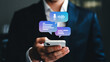 © Waqas - Professional businessman uses smartphone for instant messaging and voice communication, enhancing modern business connectivity and efficiency.