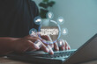 © MUNTHITA - IT professional providing technical support on laptop with digital service icons. Concept of online help desk, customer service, troubleshooting and 24-7 assistance for business technology solutions.