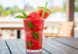 Refreshing watermelon smoothie with basil garnish offers a vibrant splash of summer fun and healthy hydration