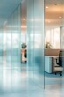 © sun - Modern office interior with glass partition walls separating workspace areas featuring office chairs, desks, and natural light creating calm and focused atmosphere