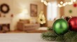 © Vyatcheslav - Close-up of red and green Christmas baubles on a wooden table. Festive holiday background with a blurred living room and bokeh lights. Winter season concept with copy space