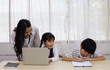 © Watercolor_Concept - Happiness Asia kid girl and mom smile portrait looking smart phone for learning at home.