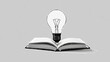 © Delocus - A light bulb resting on a book symbolizes the bright idea of creativity and innovation
