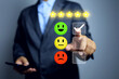 © AREE - customer feedback concept with businessman pointing on check mark to service evaluate for 5 star and smiley face represent to vary satisfaction on questionnaire