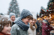 © SolaruS - Joyful family enjoying a snowy day at a festive winter market. Captures the warmth of togetherness and holiday spirit. Ideal for seasonal campaigns.