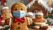 © Waloh - Close-up of gingerbread men wearing masks and bows, with a snowy backdrop featuring a house and festive decor