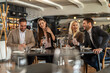 © Creative Light - Friends enjoying a meal and conversation at a stylish restaurant