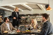 © Creative Light - Frustrated diners complain to a waitress in a fine dining restaurant