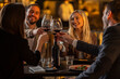 © Creative Light - Friends toasting with wine glasses at a restaurant table