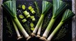 © SEPTI - Fresh Leeks and Herbs Arranged on a Dark Surface in a Culinary Setting
