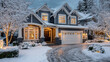 © angelmaxmixam - Beautiful modern house covered in fresh snow at dusk. Warm lights glow from windows, creating a cozy, inviting atmosphere. Perfect winter wonderland scene for holiday themes.