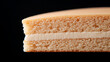© A2Z AI  - Indulge in this layered cake slice, a sweet confection on a black backdrop. The rich texture and creamy filling are beautifully highlighted in this delicious image.