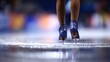 © Oleh - Figure skater wearing dazzling blue ice skates with glitter details, poised on a reflective ice rink, preparing for a performance or practicing a challenging routine