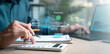 © Garun Studios - banking, finance, loan, credit, interest, fintech, deposit, Digital banking concept with holographic payment interface, calculator, and laptop representing online finance and fintech.
