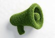 © Mamun - Green megaphone made of grass isolated on white background