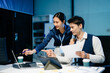 © Nuttapong punna - Asian colleagues collaborating on project in modern office, teamwork and communication for business success.