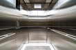 © zhu difeng - modern elevator with stainless steel walls, control buttons, and a digital floor display, clean and sleek