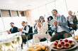 © deagreez - Group of business professionals celebrating success in an office with food and refreshments, showcasing teamwork and collaboration