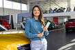 © Graphicroyalty - Caucasian woman in professional outfit holding documents, standing beside a newly launched car model in a stylish dealership, showcasing top automotive options.