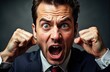 © starush - Man shouting with clenched fists and intense facial expression showing anger or frustration