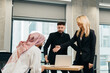© dsheremeta - Diverse business team collaborating during office meeting