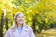 © Liubomir - Happy gray-haired senior woman smiling during a peaceful autumn park walk, enjoying sunshine, colorful foliage and an active, relaxed, healthy outdoor lifestyle