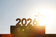 © artpluskr - New Year's sunrise in 2026, with the bright rising sun and the Holy Cross of Jesus Christ and the Bible in the background.