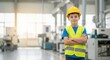 © Vasiliy - Portrait of a smiling child dressed as an engineer in a modern industrial plant. Future career and STEM education concept with copy space.