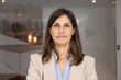 © fizkes - Positive confident business leader woman in formalwear posing for portrait