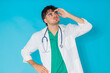 © carballo - young doctor with stethoscope and a stressed expression, isolated on a background