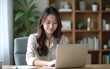 © wu - A young, beautiful relaxing business asian girl use a laptop working remotely from home on desk as a freelancer, quarantine for Coronavirus and smart working concept. High quality