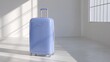 © Ndoomyim - Elegant blue suitcase positioned pristine white room interior minimalist design travel essential ready future adventures journey packing luggage.
