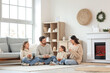 © Pixel-Shot - Young family spending time together at home